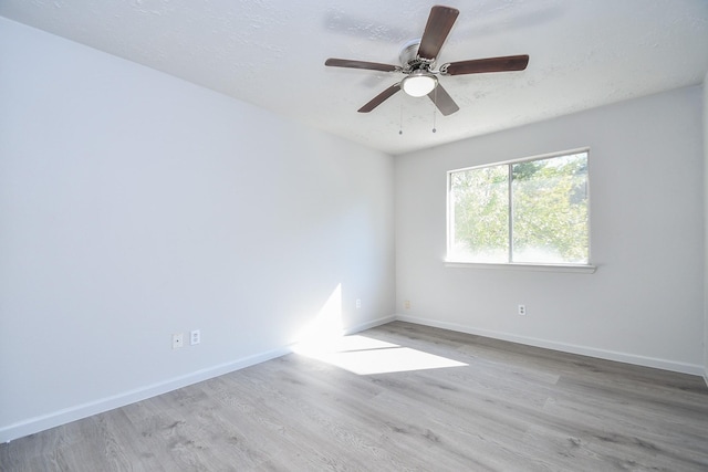 15827 Tammany Ln, Houston, TX 77082 - spare room featuring baseboards, a textured ceiling, ceiling fan, and wood finished floors