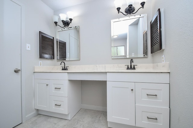 15827 Tammany Ln, Houston, TX 77082 - bathroom featuring a sink, double vanity, a notable chandelier, and baseboards