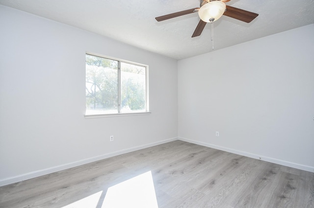 15827 Tammany Ln, Houston, TX 77082 - spare room with a textured ceiling, baseboards, ceiling fan, and light wood-type flooring