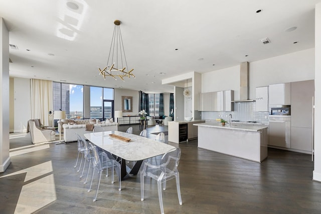 1409 Post Oak Blvd Unit 2702, Houston, TX 77056 - dining room with visible vents, an inviting chandelier, floor to ceiling windows, and dark wood-style floors