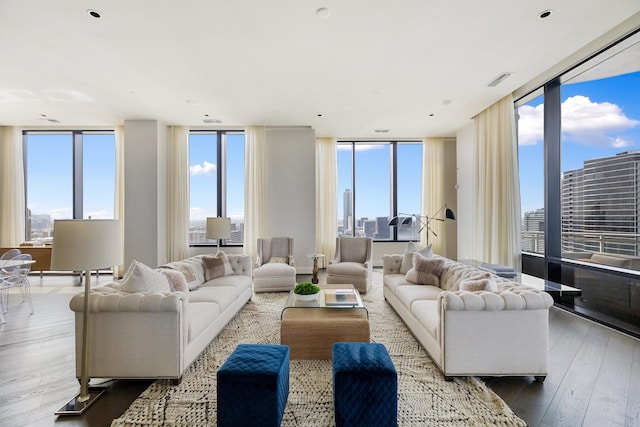 1409 Post Oak Blvd Unit 2702, Houston, TX 77056 - living room featuring plenty of natural light, expansive windows, hardwood / wood-style flooring, and a city view