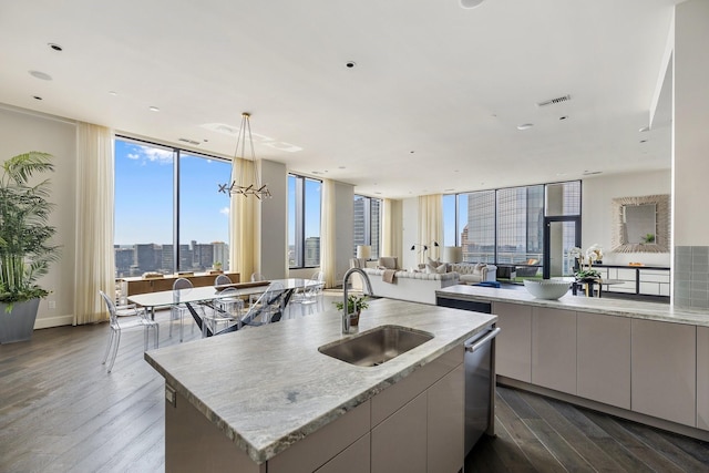 1409 Post Oak Blvd Unit 2702, Houston, TX 77056 - kitchen with dark wood-style flooring, dishwasher, visible vents, and a sink