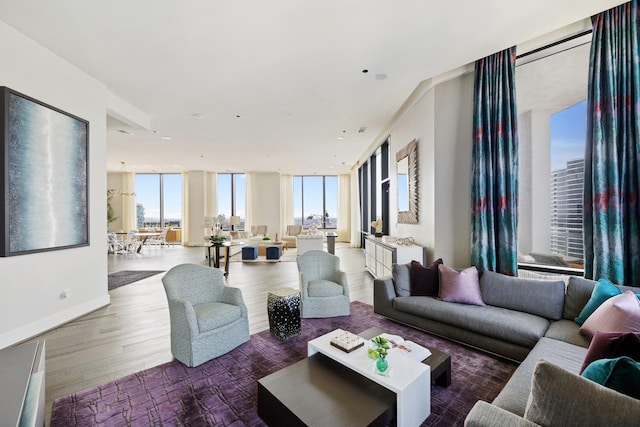 1409 Post Oak Blvd Unit 2702, Houston, TX 77056 - living area with baseboards, wood finished floors, and expansive windows
