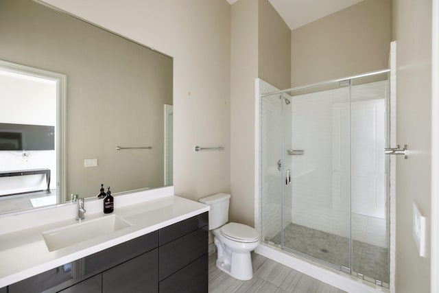 1409 Post Oak Blvd Unit 2702, Houston, TX 77056 - bathroom featuring a shower stall, vanity, and toilet
