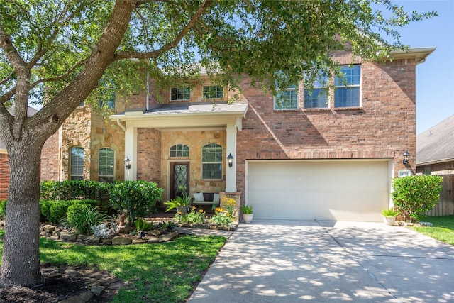 14711 E Ginger Spice Ct, Cypress, TX 77433 - traditional-style house with driveway, an attached garage, stone siding, and brick siding
