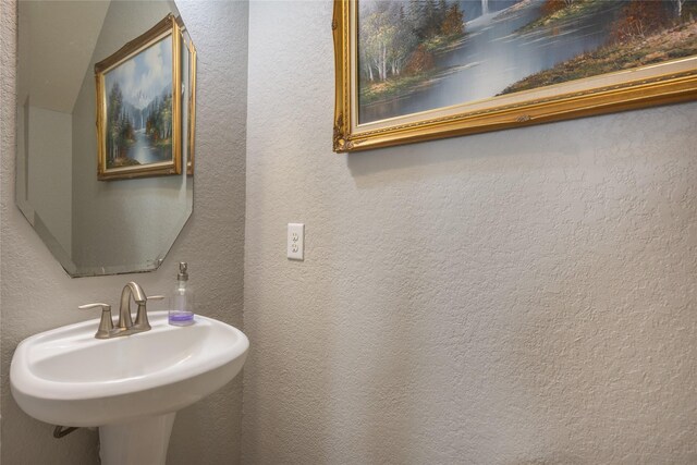 14711 E Ginger Spice Ct, Cypress, TX 77433 - bathroom with a sink and a textured wall
