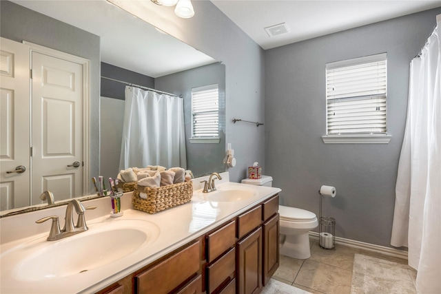 14711 E Ginger Spice Ct, Cypress, TX 77433 - full bath featuring toilet, tile patterned flooring, double vanity, baseboards, and a shower with curtain