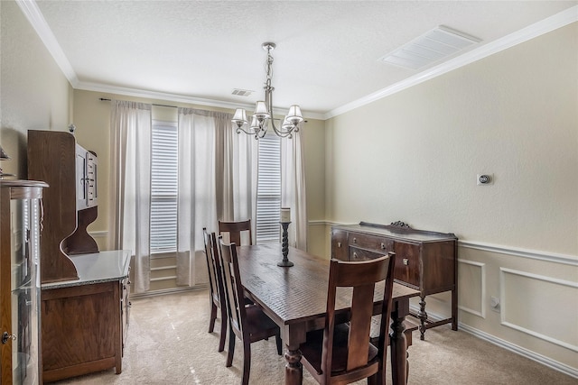 14711 E Ginger Spice Ct, Cypress, TX 77433 - dining room featuring light carpet, a chandelier, crown molding, and wainscoting
