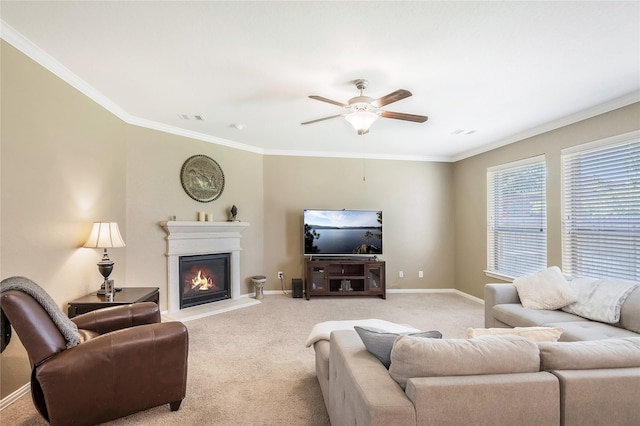 14711 E Ginger Spice Ct, Cypress, TX 77433 - living room with light carpet, a ceiling fan, ornamental molding, a glass covered fireplace, and baseboards