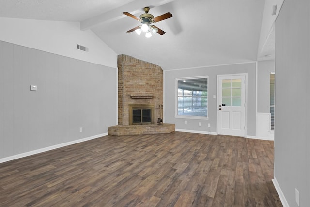 9611 Huntington Hill Dr, Houston, TX 77099 - unfurnished living room with dark wood-type flooring, beam ceiling, a ceiling fan, a fireplace, and baseboards