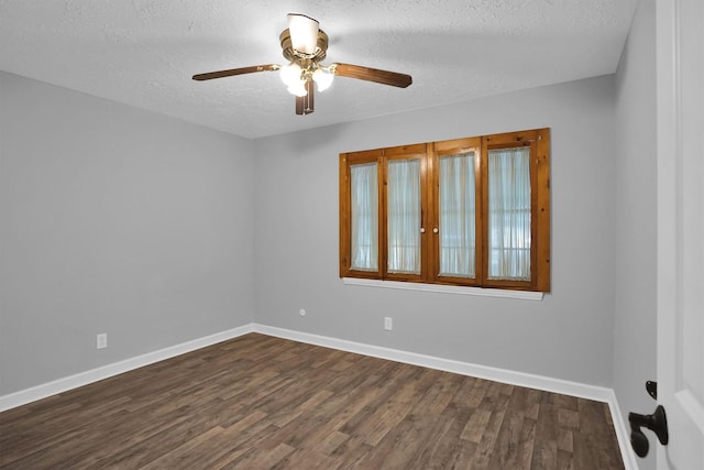 9611 Huntington Hill Dr, Houston, TX 77099 - spare room with dark wood-style floors, ceiling fan, a textured ceiling, and baseboards