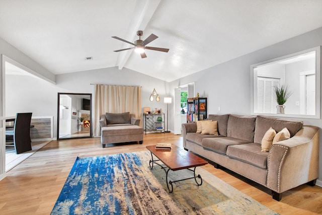 3306 Brookdale Dr, Houston, TX 77339 - living area with vaulted ceiling with beams, light wood-style floors, ceiling fan, and visible vents