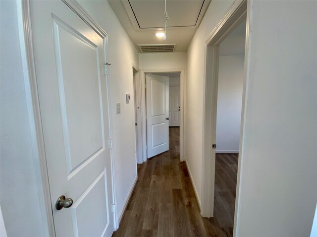 5217 Malmedy Rd A/B, Unit A/B Houston, TX 77033 - corridor with attic access and dark wood finished floors
