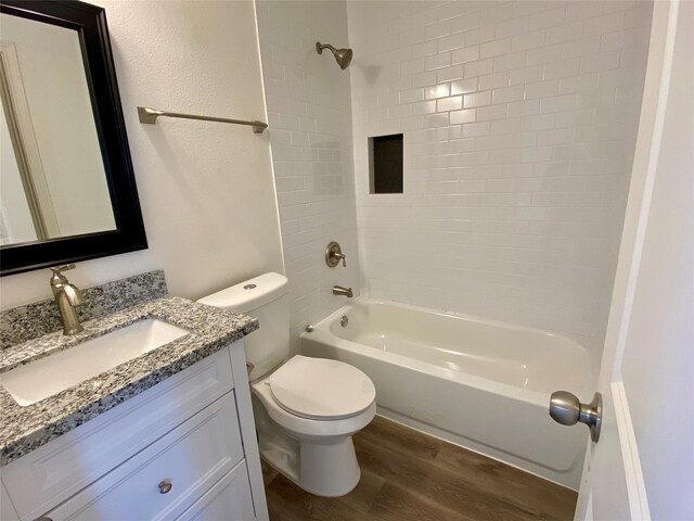 5217 Malmedy Rd A/B, Unit A/B Houston, TX 77033 - bathroom featuring wood finished floors, vanity, and  shower combination