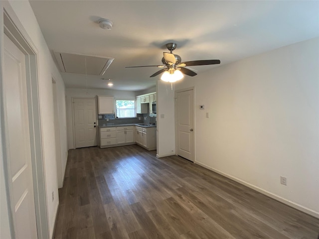 5217 Malmedy Rd A/B, Unit A/B Houston, TX 77033 - unfurnished living room with attic access, dark wood finished floors, and a ceiling fan