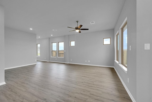 empty room featuring recessed lighting, visible vents, wood finished floors, and ceiling fan
