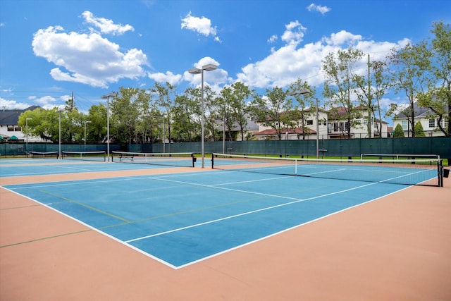 view of sport court with fence and community basketball court