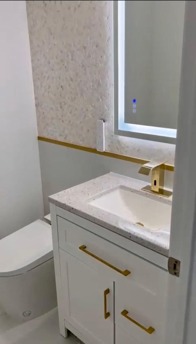 7707 Wrightwood Dr, Pasadena, TX 77505 - bathroom featuring toilet and vanity