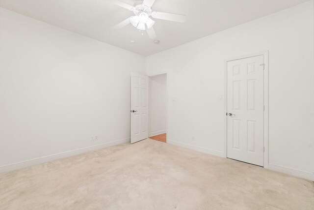 104 Mccardell Ln, Livingston, TX 77351 - spare room with a ceiling fan, baseboards, and light carpet