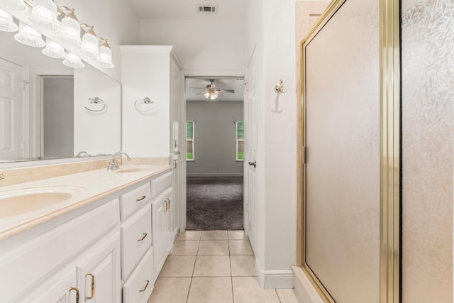 full bathroom with a sink, tile patterned floors, a ceiling fan, and visible vents
