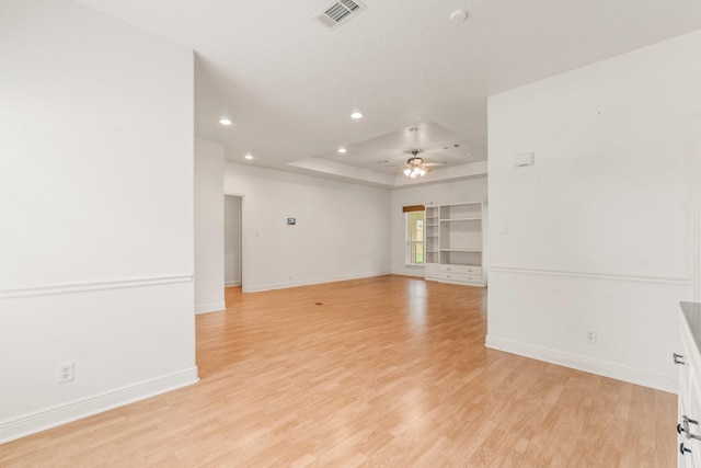 unfurnished room with visible vents, baseboards, recessed lighting, a ceiling fan, and light wood-style flooring