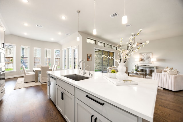 kitchen featuring open floor plan, a sink, dark wood-style floors, and visible vents