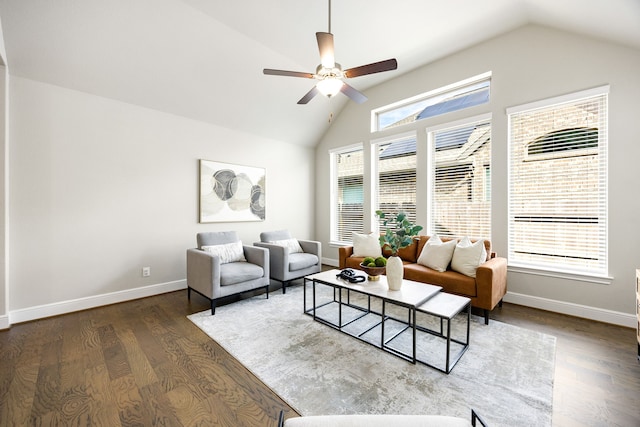 living area with wood finished floors, baseboards, lofted ceiling, and ceiling fan