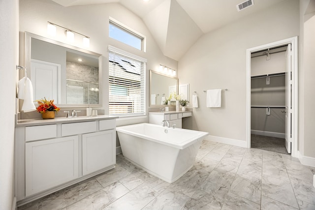 bathroom with marble finish floor, visible vents, a stall shower, and plenty of natural light