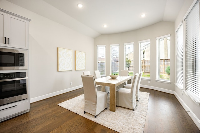 dining area with dark wood-style flooring, baseboards, lofted ceiling, and recessed lighting
