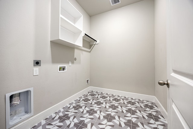 laundry area featuring tile patterned floors, hookup for a gas dryer, washer hookup, electric dryer hookup, and laundry area