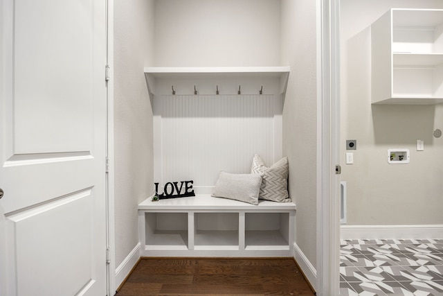 mudroom featuring baseboards and wood finished floors