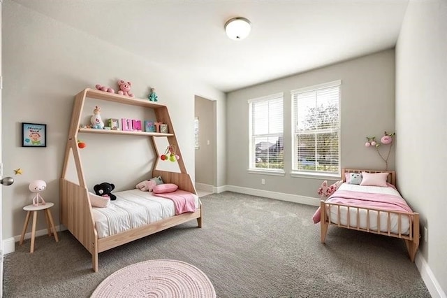 bedroom featuring carpet floors and baseboards