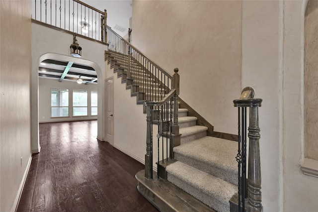4510 Sanctuary Trails Dr, Spring, TX 77388 - stairs with wood finished floors, coffered ceiling, a ceiling fan, baseboards, and beam ceiling
