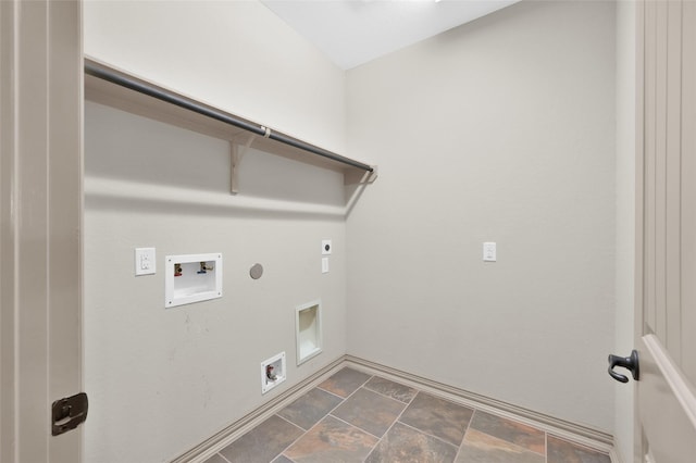 4510 Sanctuary Trails Dr, Spring, TX 77388 - laundry area featuring electric dryer hookup, hookup for a gas dryer, washer hookup, stone finish flooring, and baseboards