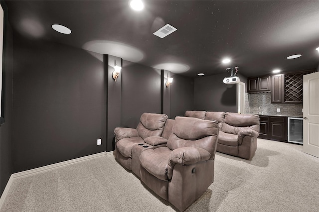 4510 Sanctuary Trails Dr, Spring, TX 77388 - cinema with wine cooler, wet bar, light colored carpet, baseboards, and recessed lighting