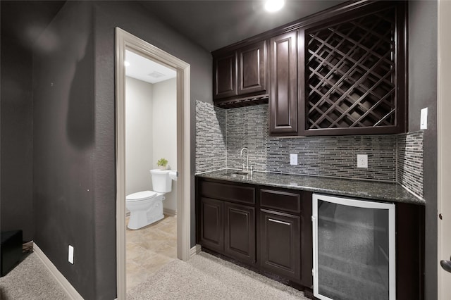 4510 Sanctuary Trails Dr, Spring, TX 77388 - indoor wet bar featuring beverage cooler, tasteful backsplash, baseboards, and recessed lighting