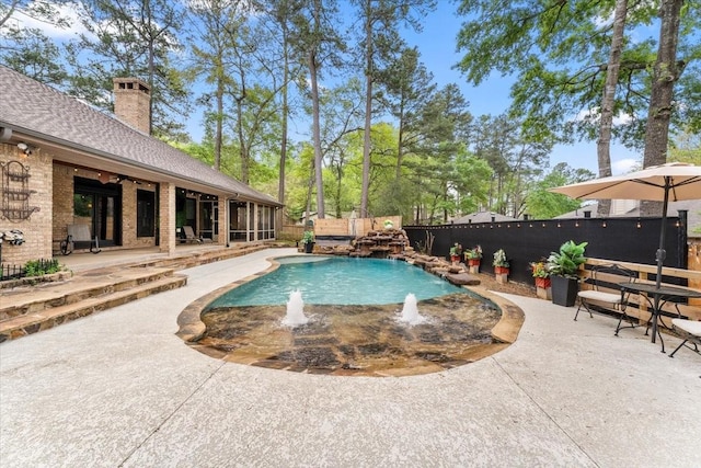 view of pool featuring a fenced in pool, a fenced backyard, and a patio area