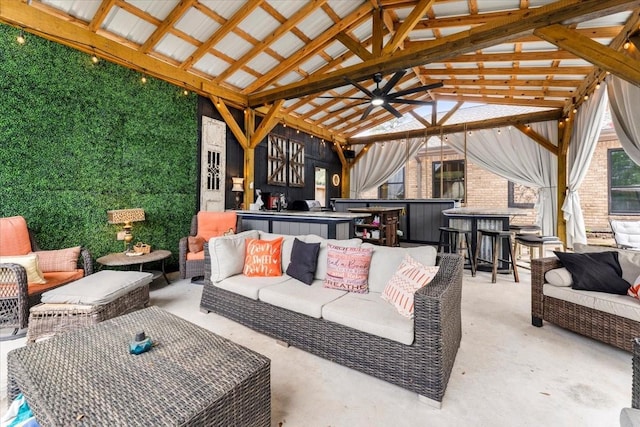 view of patio featuring an outdoor living space, ceiling fan, outdoor dry bar, and a gazebo