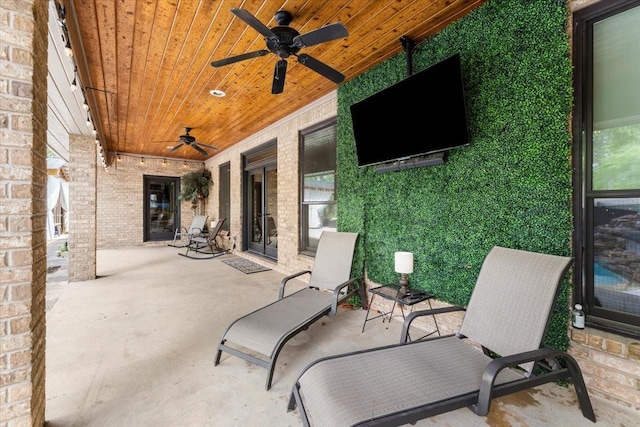 view of patio featuring a ceiling fan