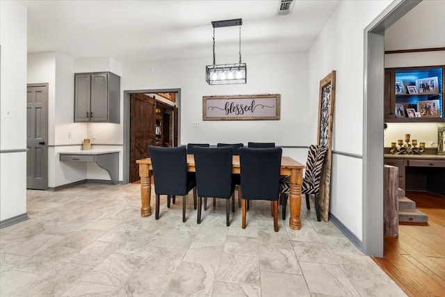 dining space with baseboards and visible vents