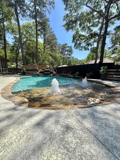 view of swimming pool with a swimming pool