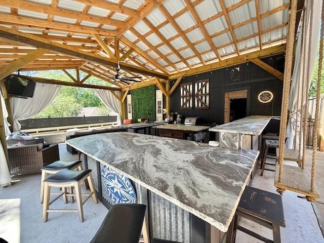 view of patio with a gazebo and outdoor wet bar