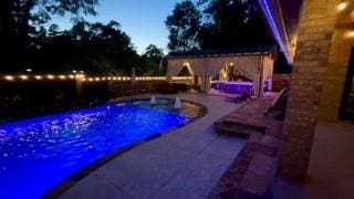 view of swimming pool featuring fence and a patio