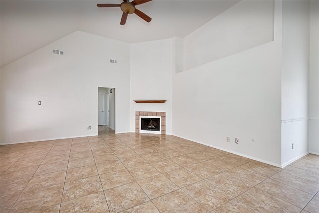 13322 Chaston Dr, Houston, TX 77041 - unfurnished living room with high vaulted ceiling, ceiling fan, a tiled fireplace, tile patterned flooring, and baseboards