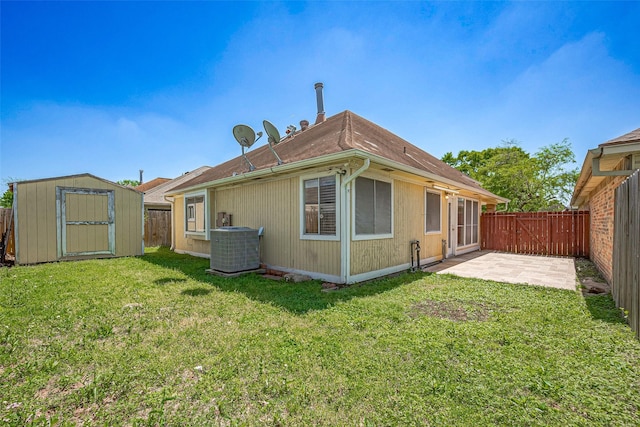 13322 Chaston Dr, Houston, TX 77041 - back of property with a patio, a storage unit, central AC unit, and an outbuilding