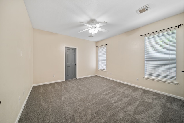 14507 Heron Marsh Dr, Cypress, TX 77429 - unfurnished room with ceiling fan, baseboards, carpet floors, and plenty of natural light