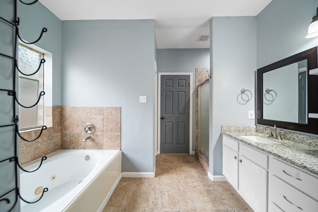 14507 Heron Marsh Dr, Cypress, TX 77429 - full bath featuring vanity, baseboards, a jetted tub, and a shower stall