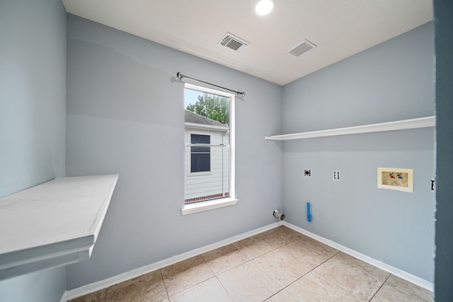 14507 Heron Marsh Dr, Cypress, TX 77429 - washroom with hookup for an electric dryer, hookup for a washing machine, gas dryer hookup, baseboards, and tile patterned floors