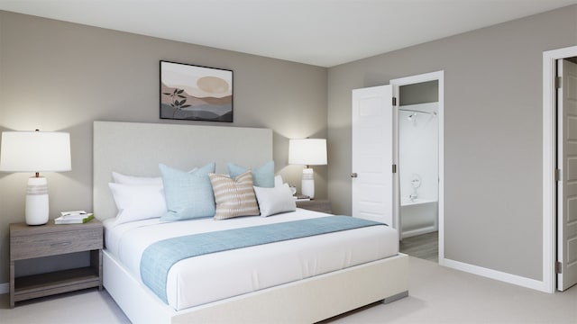 carpeted bedroom with ensuite bathroom and baseboards