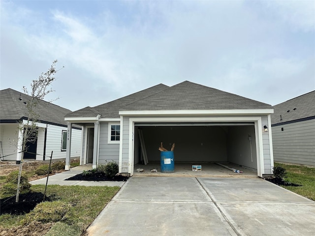 view of front of home featuring driveway and a garage